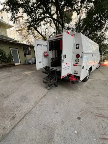 Magnet Plumbing service vehicle on-site for Grease Trap Cleaning in Conovertown